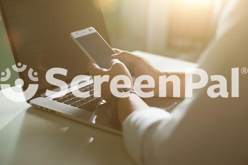 Young Man Working From Home Using Smartphone And Notebook Computer, Hands Using Smartphone In Interior, Man At His Workplace Using Technology, Flare Light.